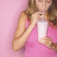 woman drinking smoothie